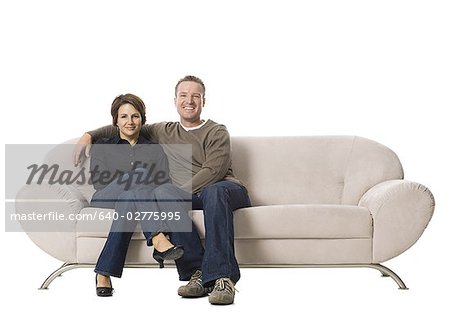 Couple sitting on a couch.