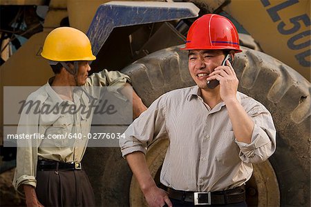 Two construction workers on the job site.