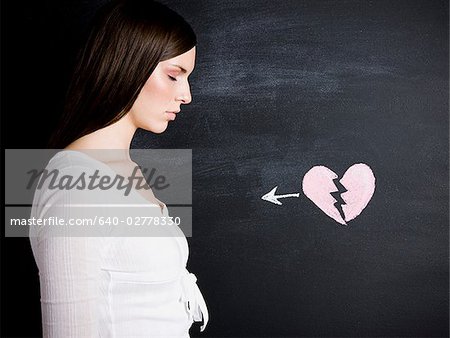 young woman against a chalkboard