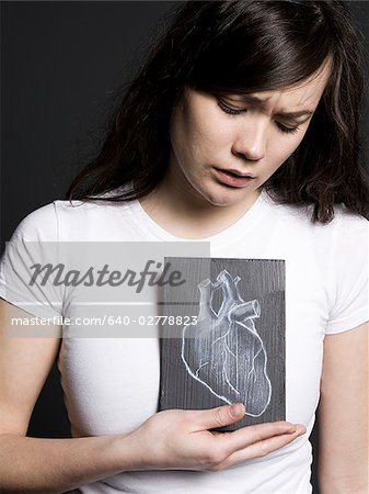 Woman with a drawing of a heart