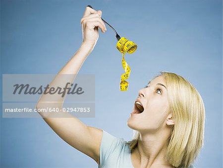 woman with a measuring tape on a fork