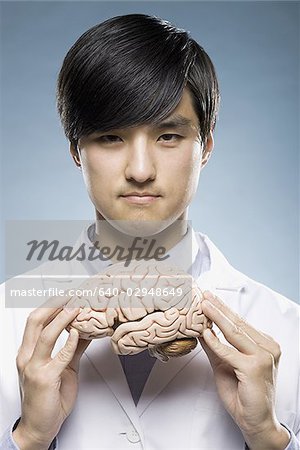 scientist holding a brain