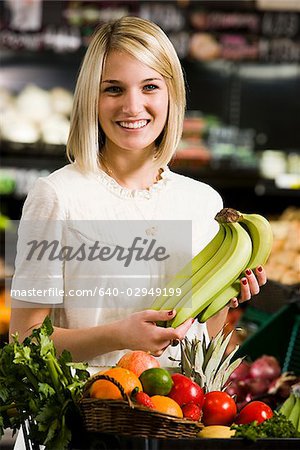 woman buying produce at the supermarket