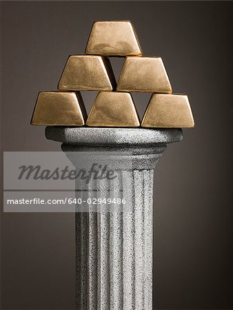 gold bars on a pedestal