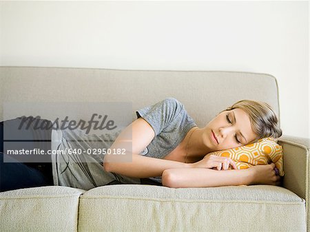 woman taking a nap on the couch