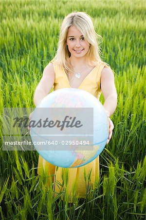 woman holding a globe