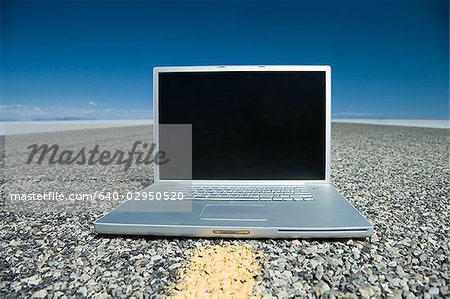 laptop in the middle of the highway