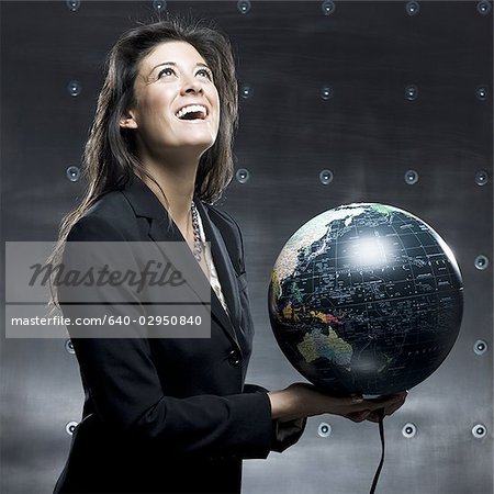 businesswoman with a globe in her hands