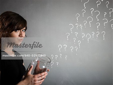 woman with a jar full of question marks