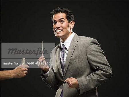 businessman drawing straws