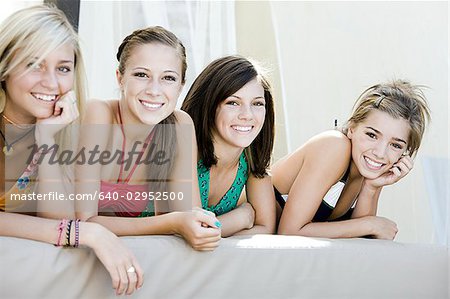 teenagers in a poolside cabana