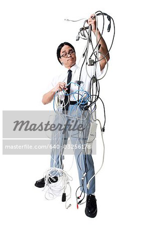 Office worker with tangled mess of wires