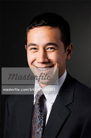 Young elegant man smiling, portrait, close-up