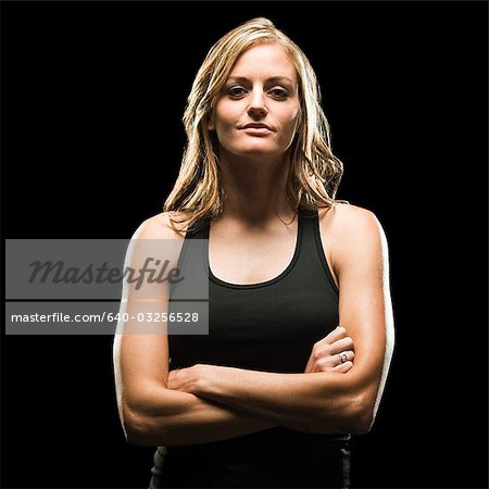 Studio portrait of young woman in tank top