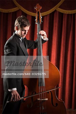 Young man playing double bass
