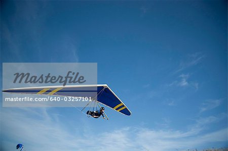 USA, Utah, Lehi, young man hang gliding, low angle view