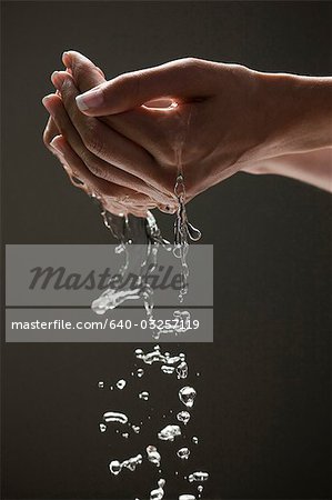 Cupped hands to the side with water Stock Photos - Page 1 : Masterfile
