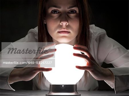 Fortune teller holding crystal ball, portrait