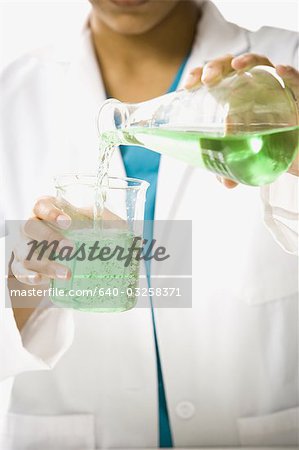 Scientist mixing chemicals