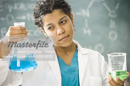 Scientist mixing chemicals