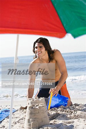 Man building a sand castle