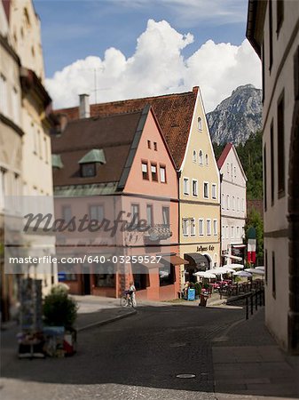 Men biking down street