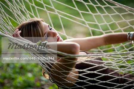 Teenage girl in a hammock sleeping