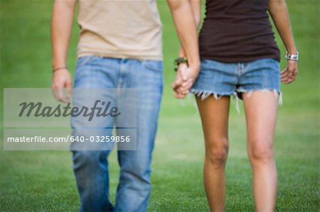 A young couple holding hands