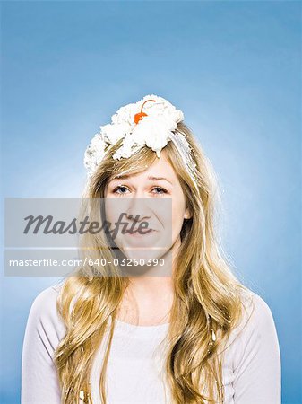 woman with whipped cream and a cherry on her head