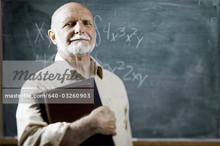 Male school teacher with books