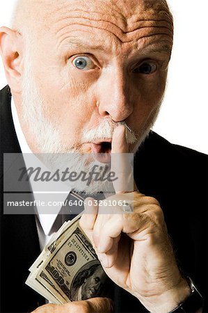 Portrait of businessman with US banknotes