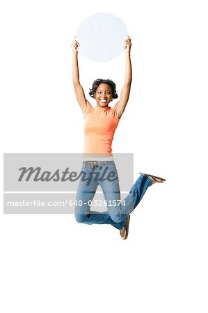 Woman leaping with blank sign