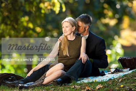 Couple having picnic outdoors