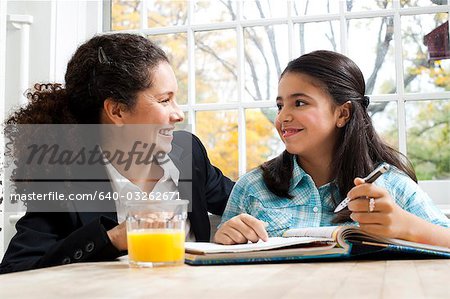 Woman and girl doing homework