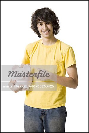 Boy holding a piggy bank