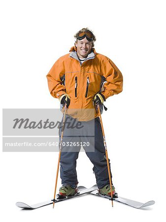 Male skier in orange ski jacket
