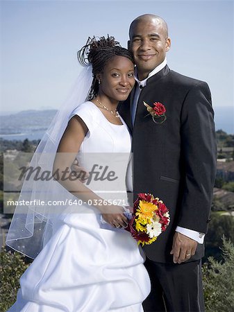 Portrait of a newlywed couple smiling together