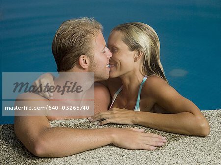 Close-up of a man and woman in a pool