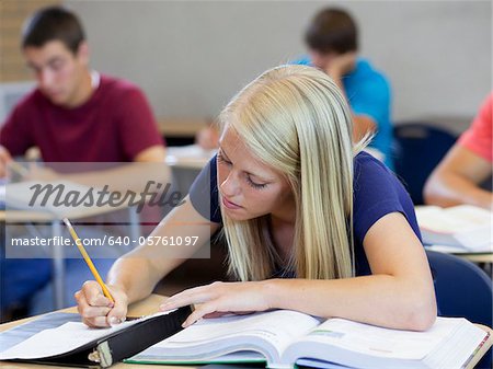 USA, Utah, Spanish Fork, School girl (16-17) working in classroom