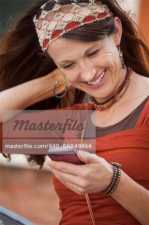 Italy, Venice, Woman text messaging using mobile phone