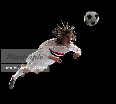 Soccer player heading the ball