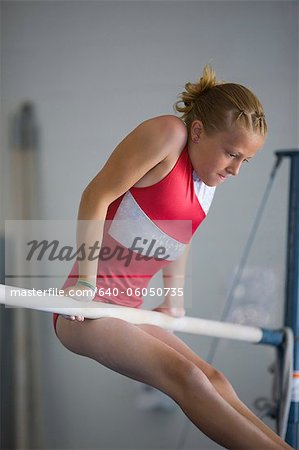 USA, Utah, Orem, girl (10-11) exercising on pole in gym