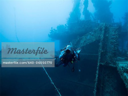 Grenada, Caribbean Sea, Scuba diver next to shipwreck