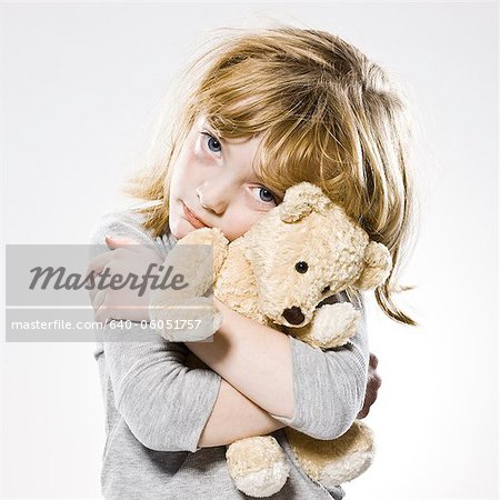 Beautiful Girl With A Teddy Bear Stock Photo, Royalty-Free