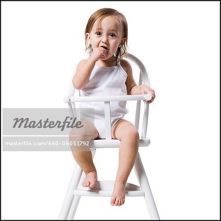 baby girl in a high chair