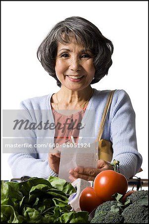 woman looking at a shopping list