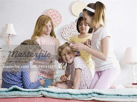 five girls on a bed