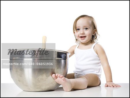 baby girl and a mixing bowl