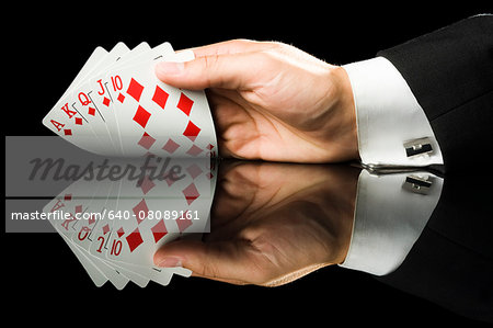 hand holding playing cards hand holding playing cards