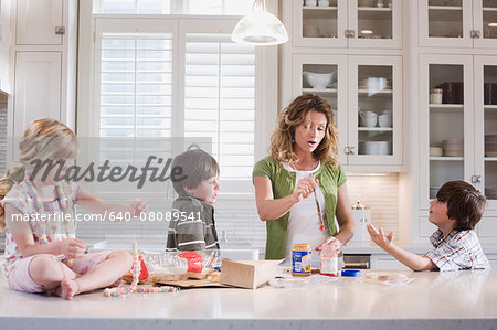 mother and children in the kitchen